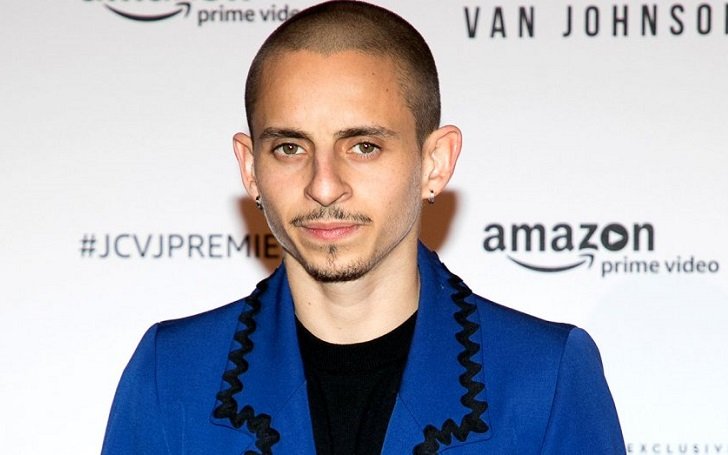 Moises in his bald look wearing a blue coat shirt. His Net Worth is estimated to be around $650,000.