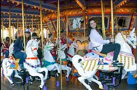 Nicole Boice (left), Founder and CEO of Global Genes, and Madison McLaughlin, star of "Arrow" taking a ride on the King Arthur Carousel during the "Carousel of Possible Dreams" fundraiser for the Festival of Children Foundation at Disneyland in 2016. (Photo by Mark Eades, Orange County Register/SCNG)