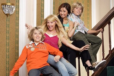 Cole Sprouse, Ashley Tisdale, Brenda Song and Dylan Sprouse sitting on a stair handle for The Suite Life Of Zack and Cody.