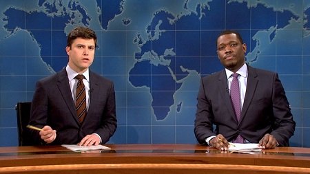 Colin Jost and Michael Che hosting the Weekend Update of SNL. Jost has a net worth of $6 million.