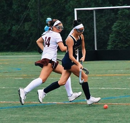 Dixie D'Amelio in action playing field hockey for the Vikings.