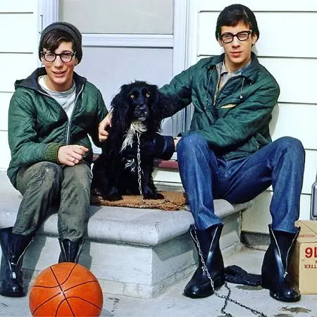 Young Marty and Rick Lagina in front of their doorstep with their dog.