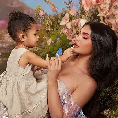 Stormi funnily applying lipstick on her mother Kylie Jenner's lips.