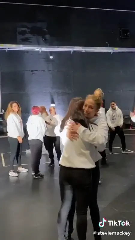 Jennifer Lopez's face is seen as she hugs Charli D'Amelio after the dance ended.