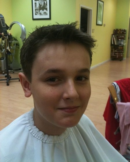 A 10-year-old Bryce Hall during a haircut.