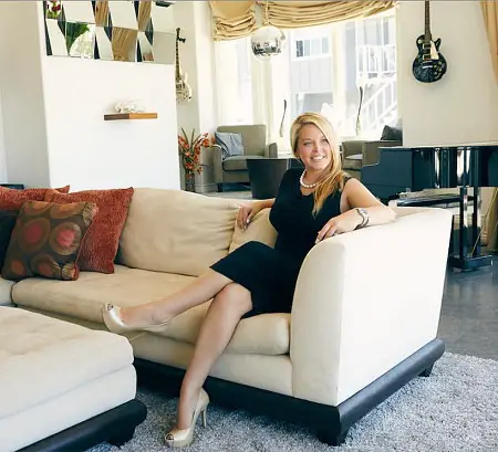 Elizabeth Lyn Vargas sitting on a sofa as the creator of Edge Music Network.