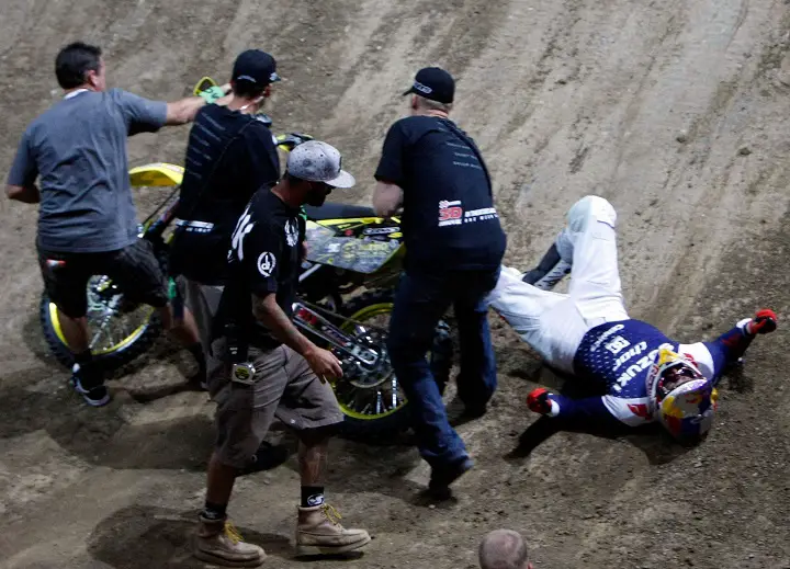 Travis Pastrana is attended to after crashing while competing in the Moto X Best Trick Final during X Games 15 at Staples Center on July 31, 2009 in Los Angeles, California.