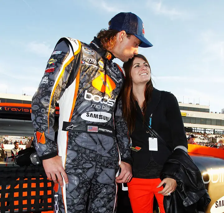 RICHMOND, VA - APRIL 27: Travis Pastrana (L), driver of the #99 Boost Mobile Toyota, and his wife Lyn-Z stand on the grid before the NASCAR Nationwide Series Virginia 529 College Savings 250 at Richmond International Raceway on April 27, 2012 in Richmond, Virginia.