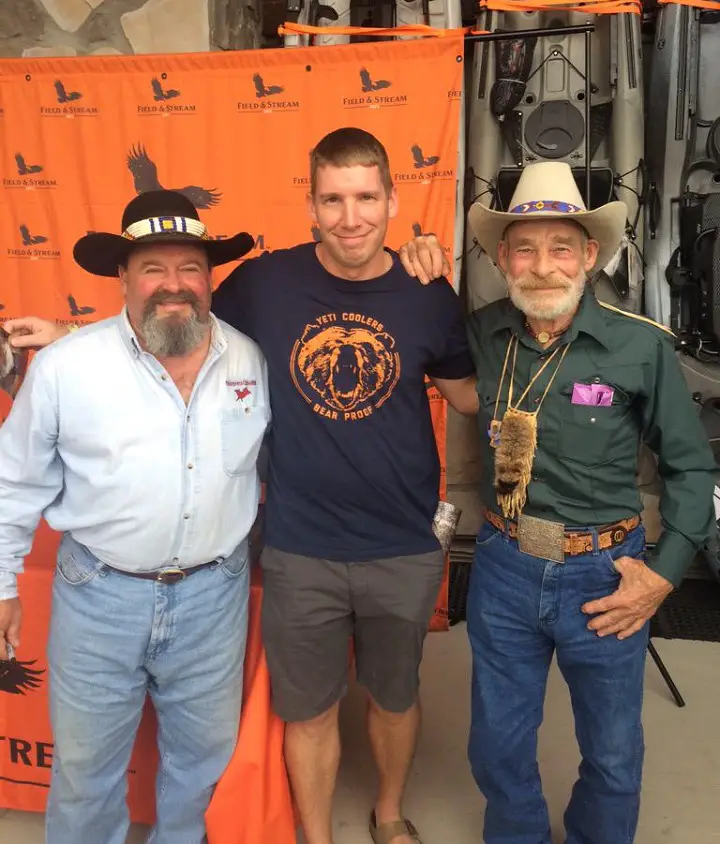 Tom Oar (right) with two of his fans at a Polaris Store.
