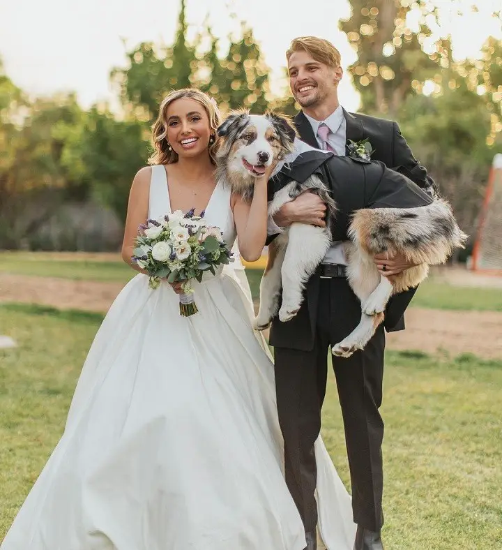 Former YouTuber couple Lexi Hensler (left) and Christian Wilson (right) with a dog in a photoshoot during their fake wedding prank event.