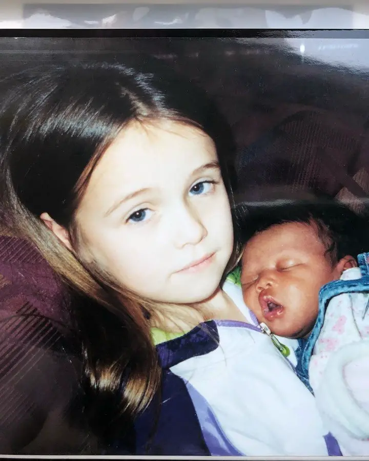A young Acacia Kersey with her adopted sister Maleia as a newborn baby.