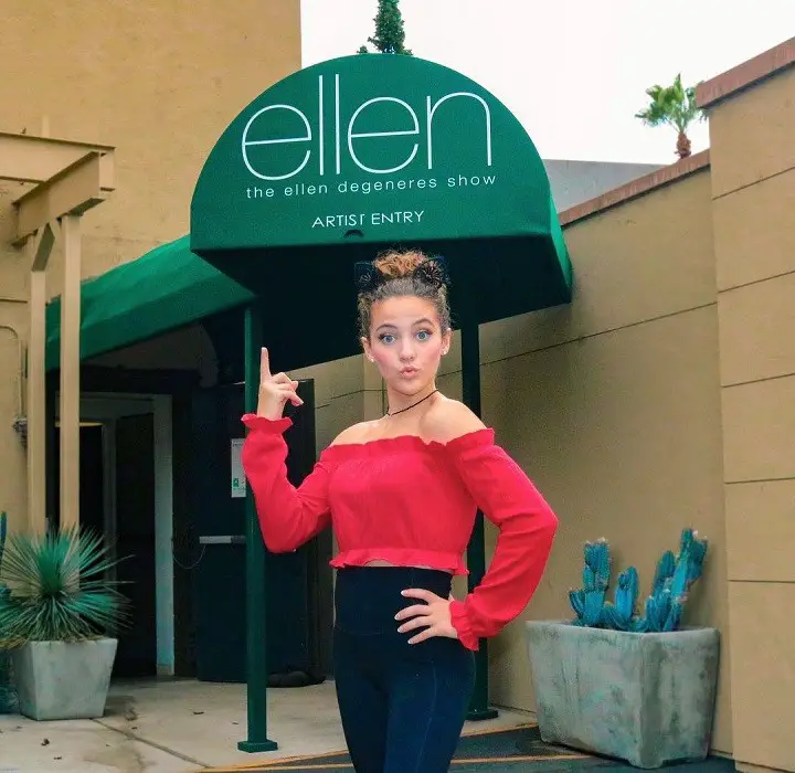 Sofie Dossi posing in front of the Ellen Show stage's guest entrance.