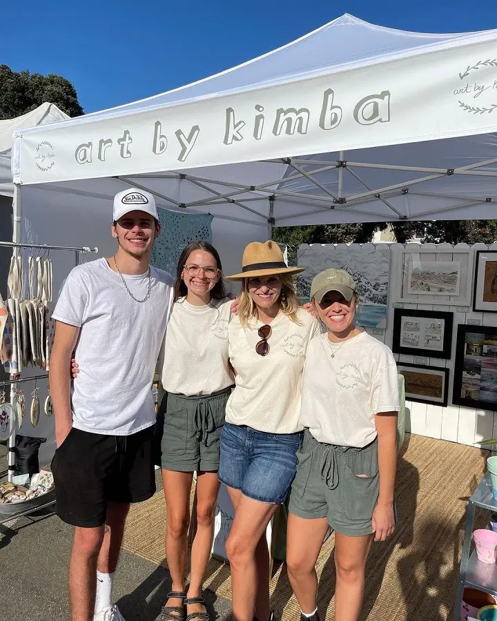 Caleb Burton (left) with his sisters Melissa Burton (right), Kimba Burton (second left) and their mother Shellie Burton (second right) at the Manhattan Beach Hometown Fair.