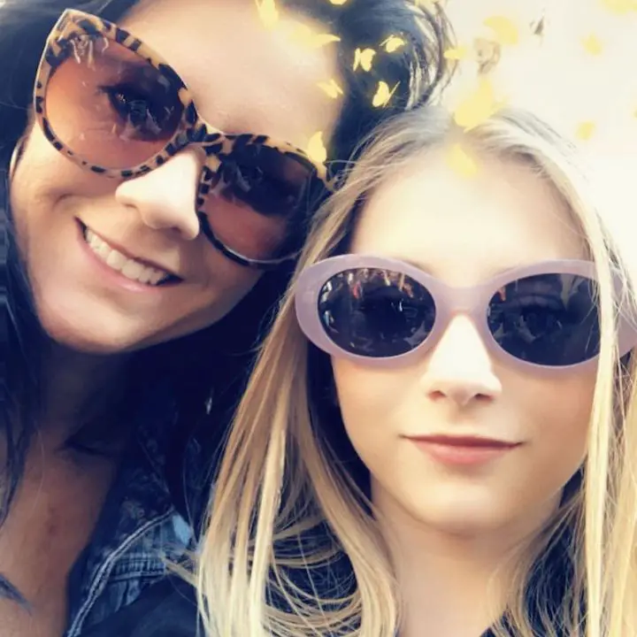 Elliana Walmsley (right) with her mother (left) taking a selfie in sunglasses and a filter on.