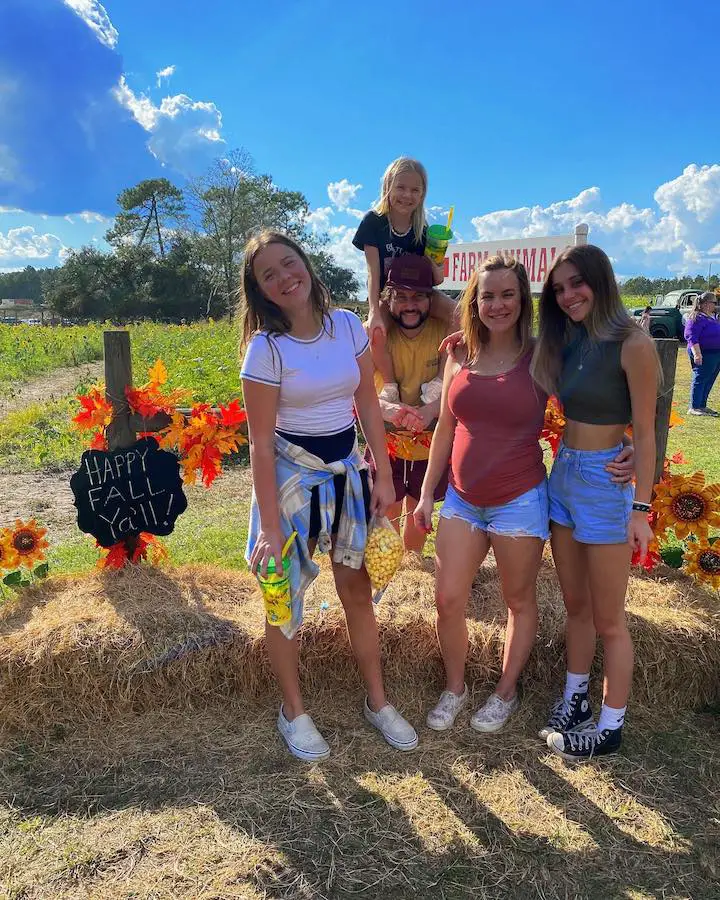 SmellyBellyTV members Jessie Vlach (second left), Terra Vlach (second right), Aydah Vlach (left) and Jayla Vlach (right) with their youngest Rory Vlach on top of the father Jesse.