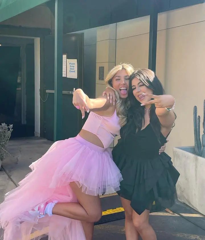Sophia Grace Brownlee (right) and her cousin Rosie McClelland (left) in adult tutus in front of the Ellen Show's celebrity entrance.