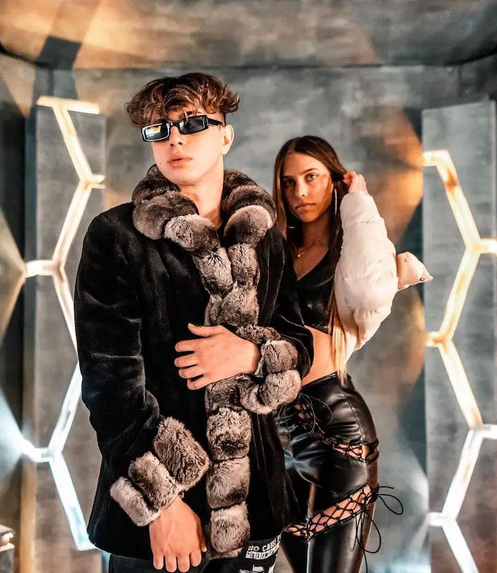 Keemokazi (left) beside a model (right) for his music video of his song 'Colors'.