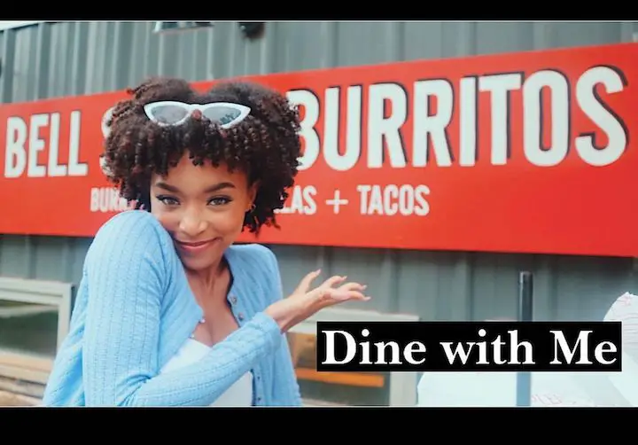 Summer Madison's YouTube snapshot of her showcasing a taco bell place with the words, 'Dine with Me', written on it.