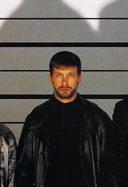 Stephen Baldwin standing in a criminal lineup as his role on 'The Usual Suspects'.