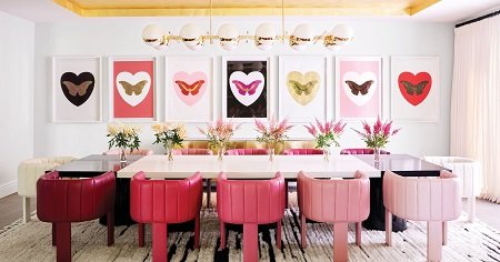 A Dining table at Kylie's house all in pink with fancy items.