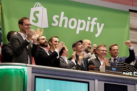 Everyone is clapping for Tobi Lutke (net worth $2.8 Billion) in the stands looking at a screen (not shown in photo) for he is a genius who created shopify.