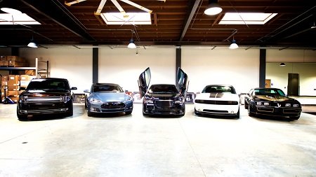 The Chrysler 300 SRT8 takes center stage with the 2013 Ford Flex, the Tesla Model S, the Dodge Challenger Hellcat and the Trans-Am on its either sides.