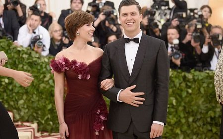 Scarlett Johansson looking soulfully at her fiance, Colin Jost.