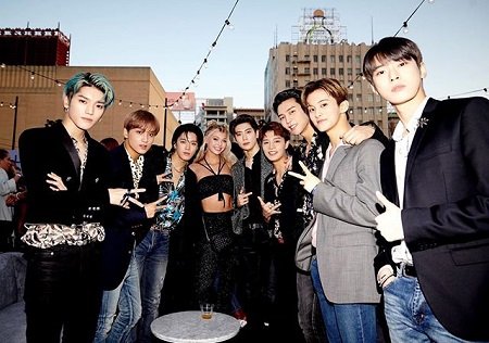 Loren Gray pictured in the center with the K-pop group NCT 127.