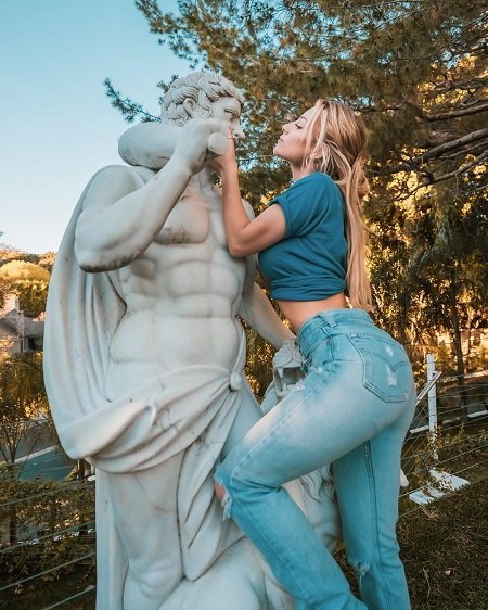 Daisy Keech in a Greek Statue.