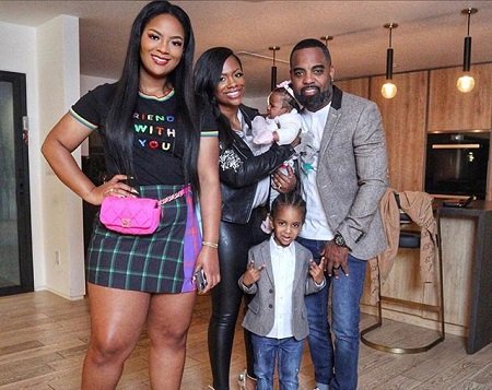 Kandi Burruss in a family picture with a daughter and two sons, with husband Todd.