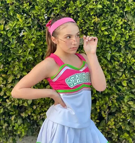 Piper Rockelle in a tennis outfit with glasses.