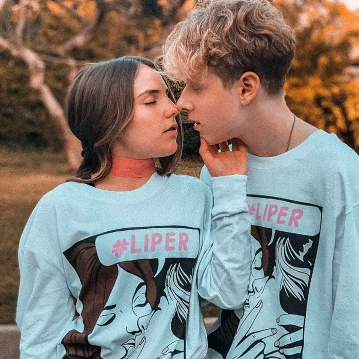 Piper Rockelle and her boyfriend Lev Cameron in an almost kissing pose wearing their official Liper merch.