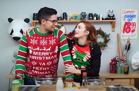 Julie Nolke and Her Boyfriend Sam Larson in a Christmas vibe staring at each other.