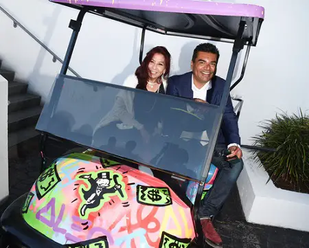 Anna Shay (L) and comedian George Lopez attend the 8th Annual George Lopez Celebrity Golf Classic Pre-Party at the SLS Hotel on May 3, 2015 in Beverly Hills, California.