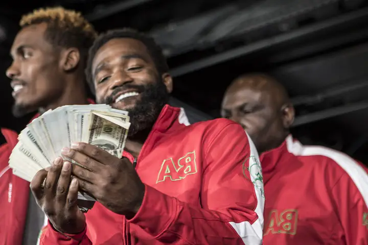 Adrien Broner flashing money during the Adrien Broner vs Mikey Garcia Final Press Conference at the Dream Hotel July 27, 2017 in New York City.