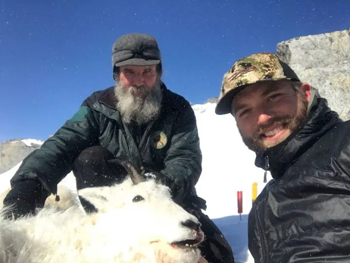 Mike Horstman (left) with a client (right) during one of their mountain goat hunts.