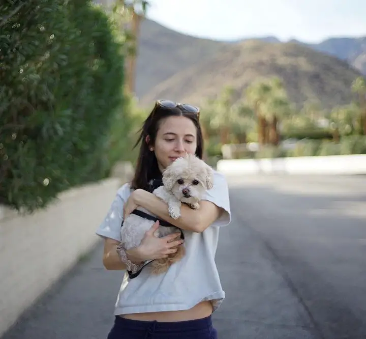 Esther Povitsky holding her dog.