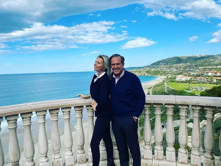 Peter Cancro (right) with his second & current wife Tatiana Voevodina Cancro on a rooftop overlooking the ocean.