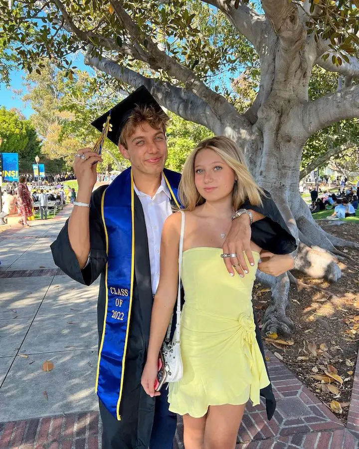 Nicolette Durazzo (right) in a yellow dress with her brother Shea Durrazo (left) in his graduation outfit after his graduation.