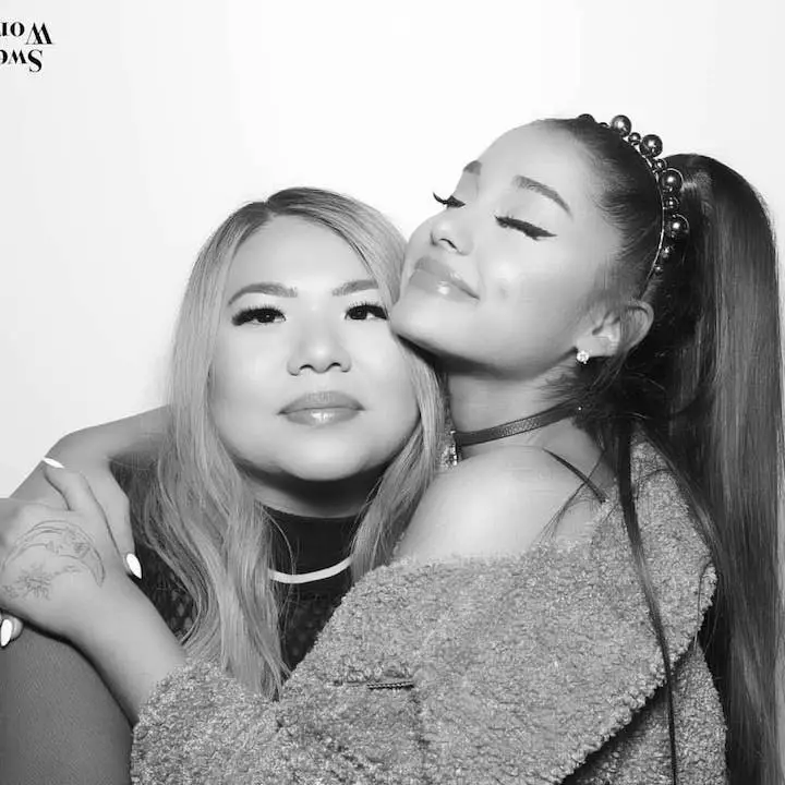 GoldenGlare (left) being hugged by Ariana Grande (right) in a photoshopped B/W photo.