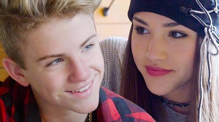 Gracie Haschak (right) looking right at Matty B (left) in a close up shot as part of their music video.