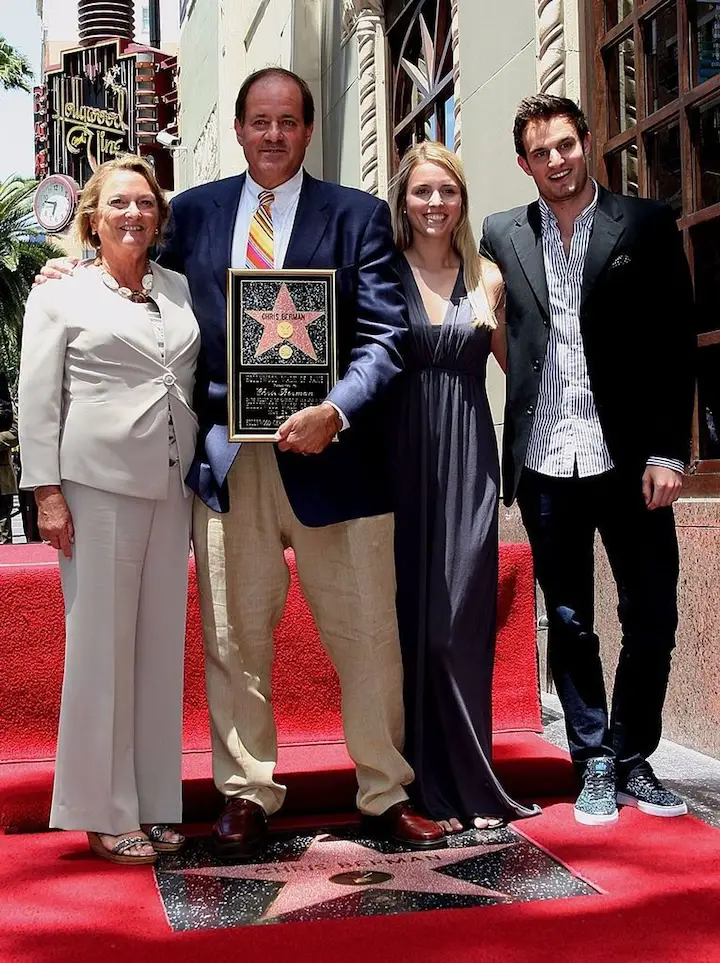 Sports anchor Chris Berman (C) and his family pose for photographers during installation ceremony honoring him with a star on the Hollywood Walk of Fame on May 24, 2010 in Hollywood, California.