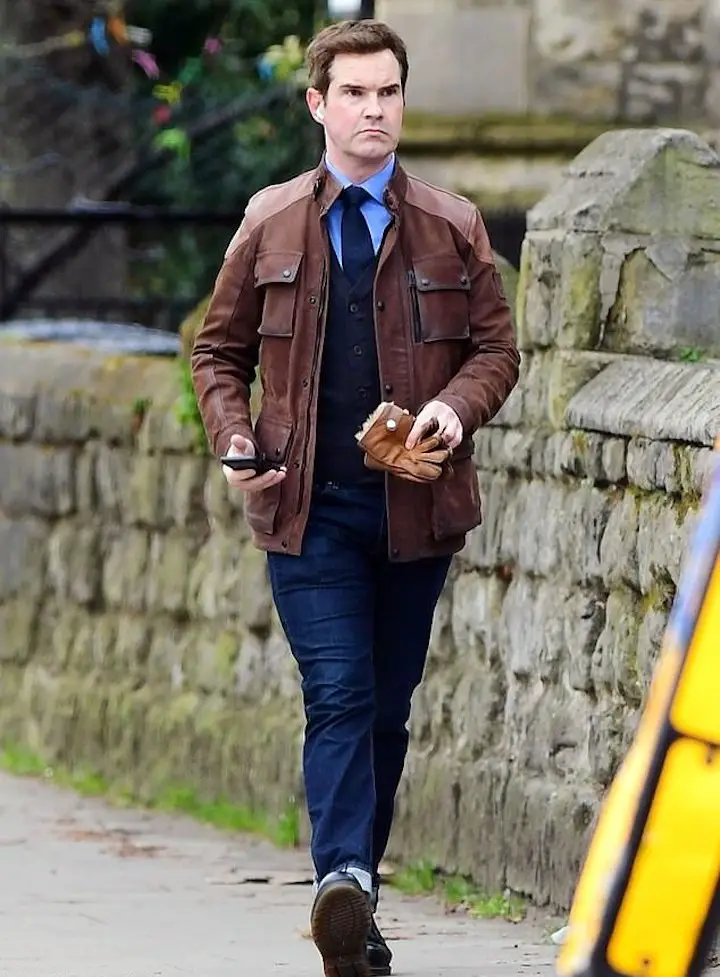 Jimmy Carr wearing a brown leather jacket with rusty red hair during a stroll through the streets of north London in May 2021.