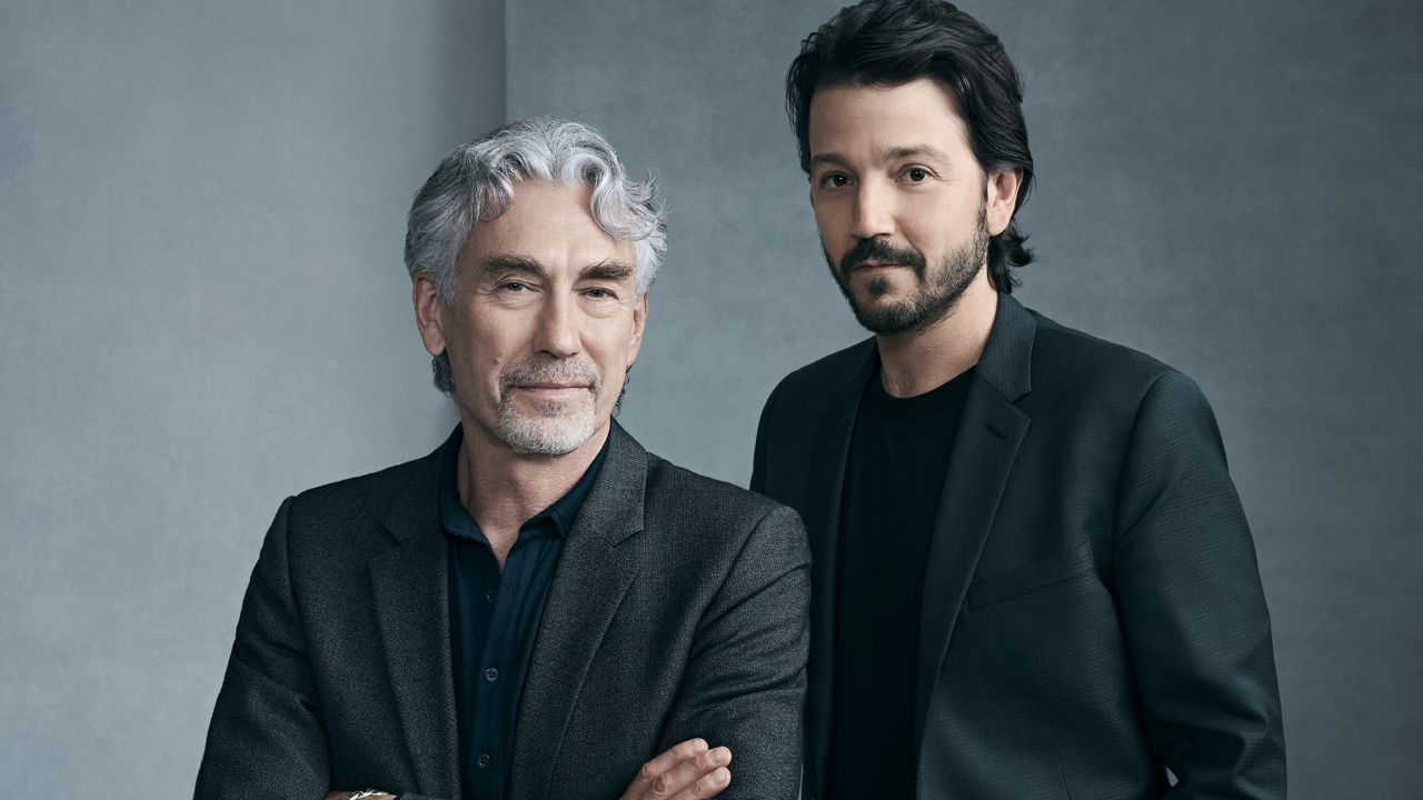 In this photo, Tony Gilroy, the mastermind behind the critically acclaimed 'Andor' series, stands alongside Diego Luna. Gilroy's exceptional work on 'Andor,' with its intricate storytelling and impressive $645 million budget, has solidified his reputation as a visionary in the industry. As of 2025, his net worth is estimated at $40 million, reflecting his successful career as a screenwriter, director, and producer.